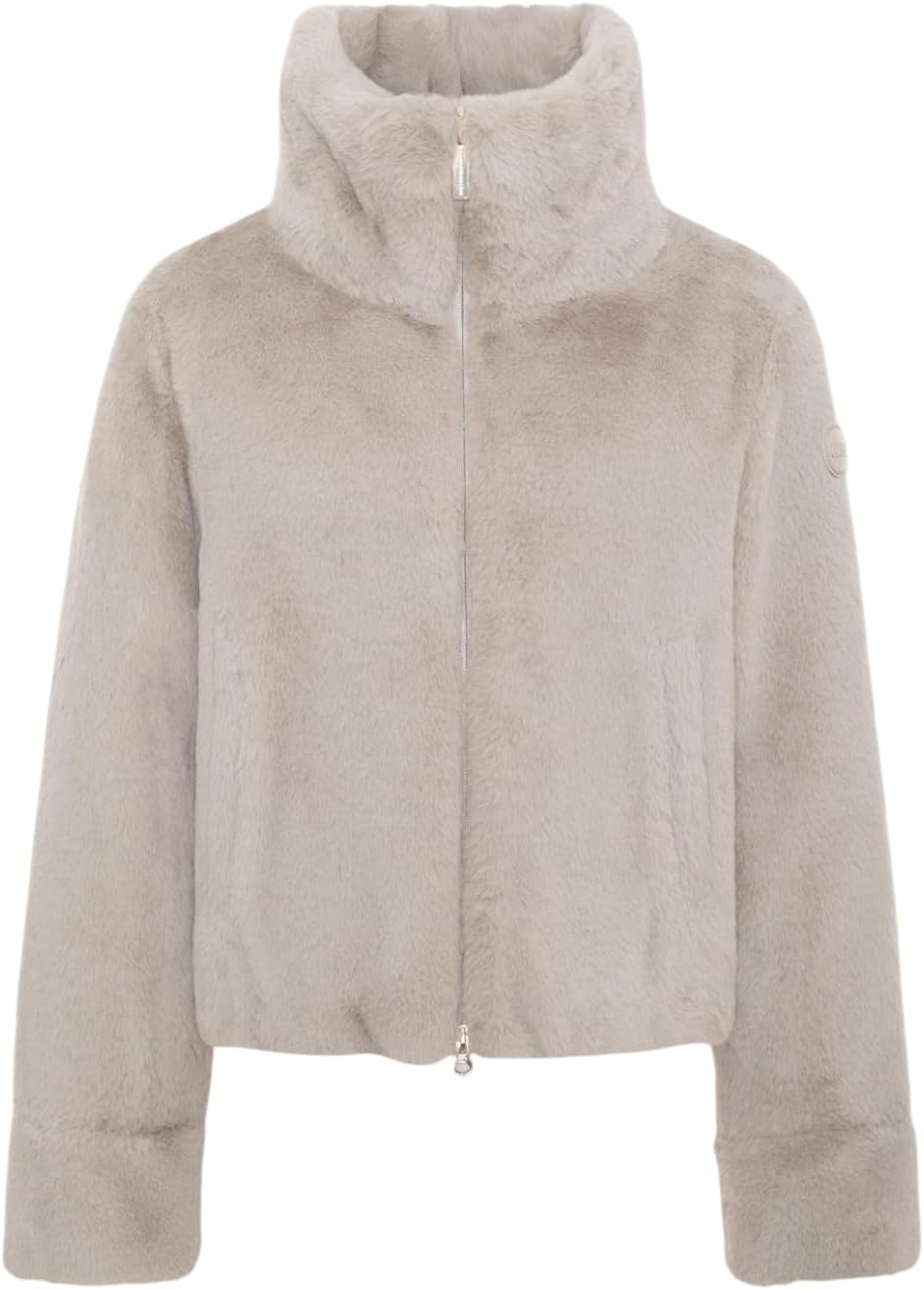 Pavo Monitor Arm installed on a standing desk with monitor adjusted to eye level