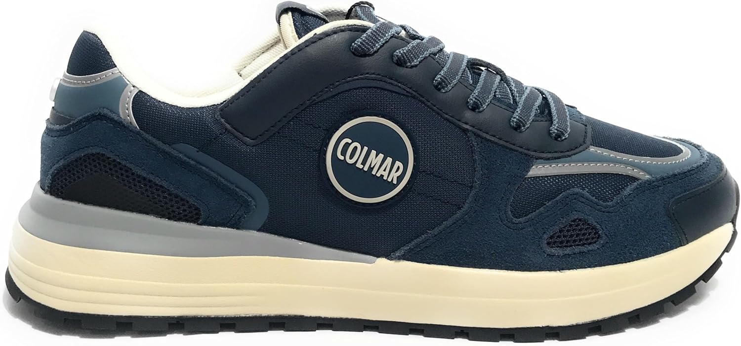 Pavo Monitor Arm installed on a wooden desk with cables organized